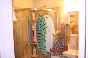 When showers threaten but we still have damp clothes, we've learned we can help them to dry by hanging them in the shower